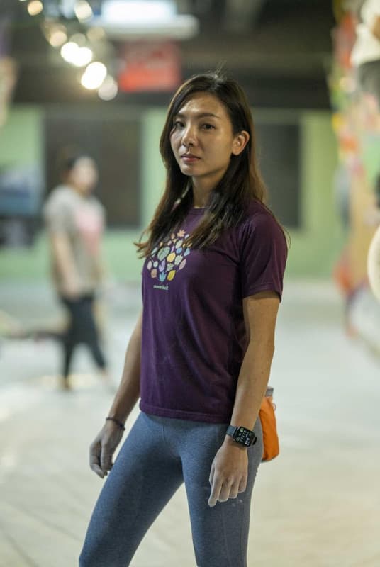 A climber scaling a steep rock face.