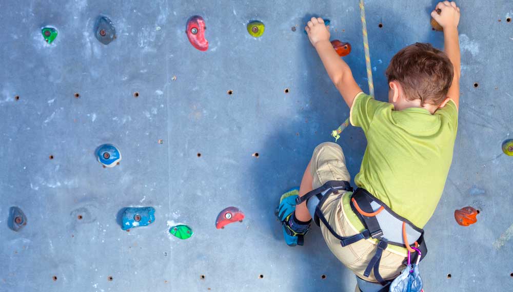 Climber on an outdoor bouldering rock.