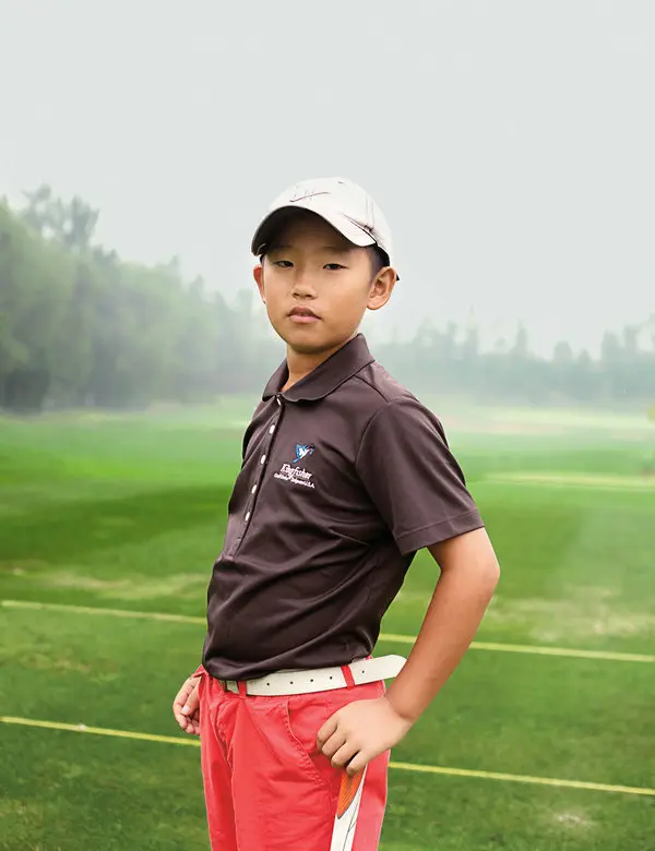A golf ball on a pristine green near the hole.